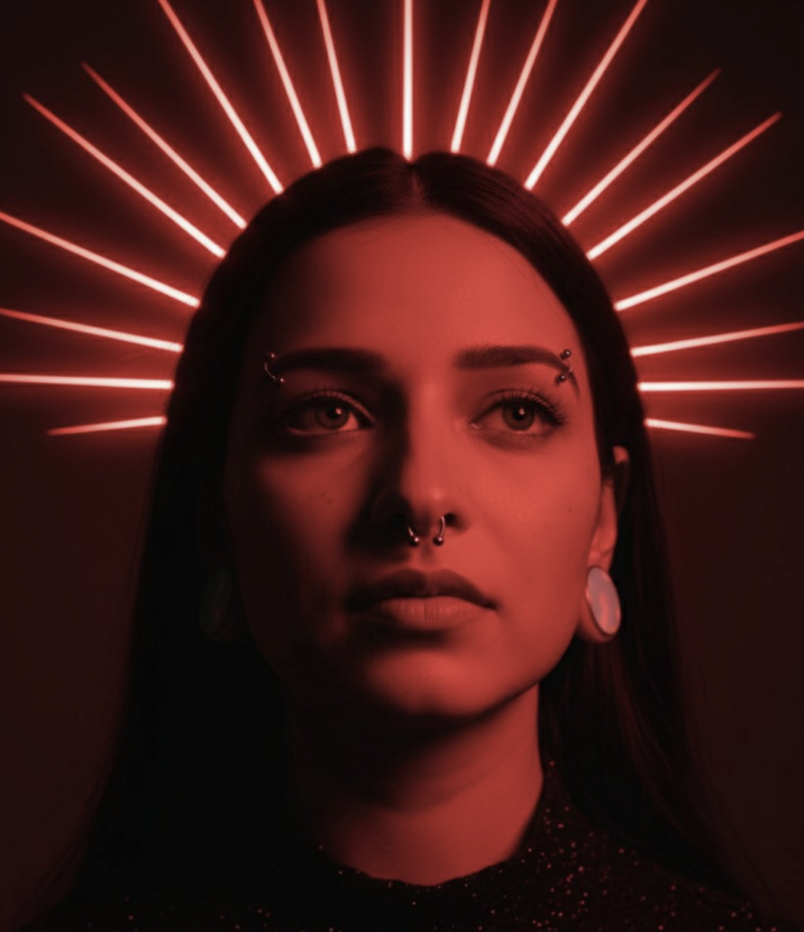 Woman bathed in intense crimson lighting